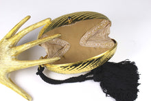 Golden egg clutch with wrist double tassel