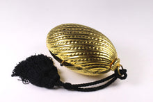 Golden egg clutch with wrist double tassel