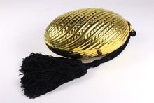 Golden egg clutch with wrist double tassel