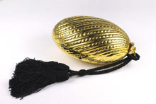 Golden egg clutch with wrist double tassel