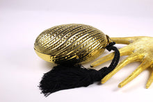 Golden egg clutch with wrist double tassel