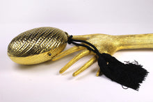 Golden egg clutch with wrist double tassel
