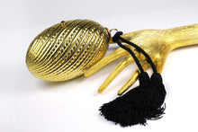 Golden egg clutch with wrist double tassel