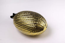 Golden egg clutch with wrist double tassel