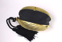 Golden egg clutch with wrist double tassel