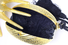 Golden egg clutch with wrist double tassel