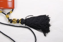 YVES SAINT LAURENT Opium perfume pendant