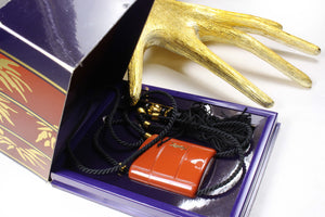 YVES SAINT LAURENT Opium perfume pendant