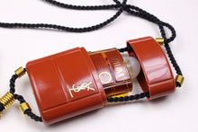 YVES SAINT LAURENT Opium perfume pendant