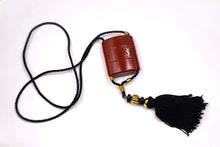 YVES SAINT LAURENT Opium perfume pendant