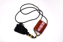 YVES SAINT LAURENT Opium perfume pendant