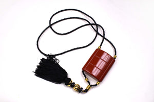 YVES SAINT LAURENT Opium perfume pendant