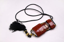 YVES SAINT LAURENT Opium perfume pendant