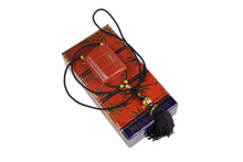 YVES SAINT LAURENT Opium perfume pendant