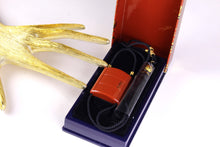YVES SAINT LAURENT Opium perfume pendant