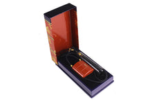 YVES SAINT LAURENT Opium perfume pendant