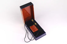 YVES SAINT LAURENT Opium perfume pendant
