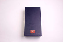 YVES SAINT LAURENT Opium perfume pendant
