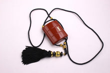 YVES SAINT LAURENT Opium perfume pendant