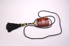 YVES SAINT LAURENT Opium perfume pendant