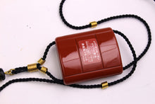 YVES SAINT LAURENT Opium perfume pendant