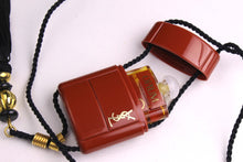 YVES SAINT LAURENT Opium perfume pendant