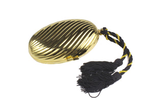 Golden oval-shaped clutch with tassel