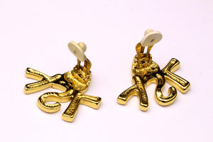 YVES SAINT LAURENT initials over heart earrings