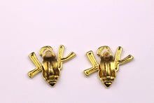 YVES SAINT LAURENT initials over heart earrings