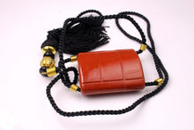 YVES SAINT LAURENT Opium perfume pendant
