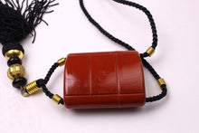 YVES SAINT LAURENT Opium perfume pendant