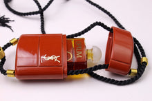 YVES SAINT LAURENT Opium perfume pendant