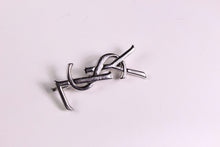 YVES SAINT LAURENT Logo silver brooch