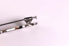 YVES SAINT LAURENT Logo silver brooch