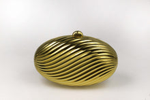 MENBUR golden metal oval-shaped clutch
