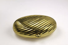 MENBUR golden metal oval-shaped clutch