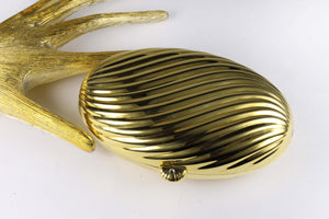MENBUR golden metal oval-shaped clutch