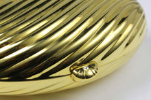 MENBUR golden metal oval-shaped clutch