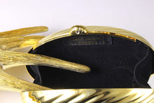 MENBUR golden metal oval-shaped clutch