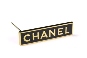 CHANEL rectangular logo brooch