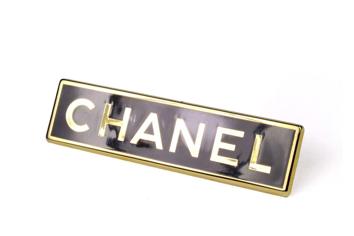 CHANEL rectangular logo brooch