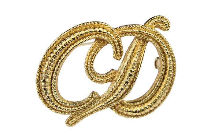 CHRISTIAN DIOR Logo embossed brooch