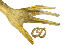 CHRISTIAN DIOR Logo embossed brooch