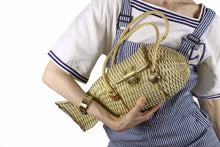 White and gold plastic wicker fish purse bag