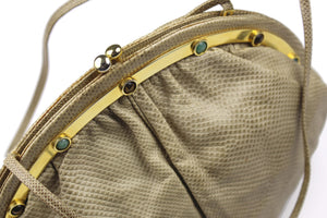 JUDITH LEIBER beige snake skin clutch with semicircular jewel frame