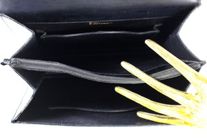 TORRENS jet black crocodile skin handbag with flap and decorative clasp