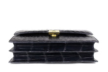 TORRENS jet black crocodile skin handbag with flap and decorative clasp