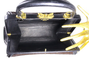 Black leather and brown fur frame handbag