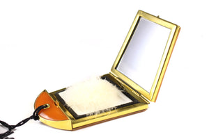 Bakelite powder compact case with lipstick