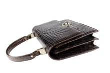 Brown crocodile skin handbag with flap and decorative clasp
